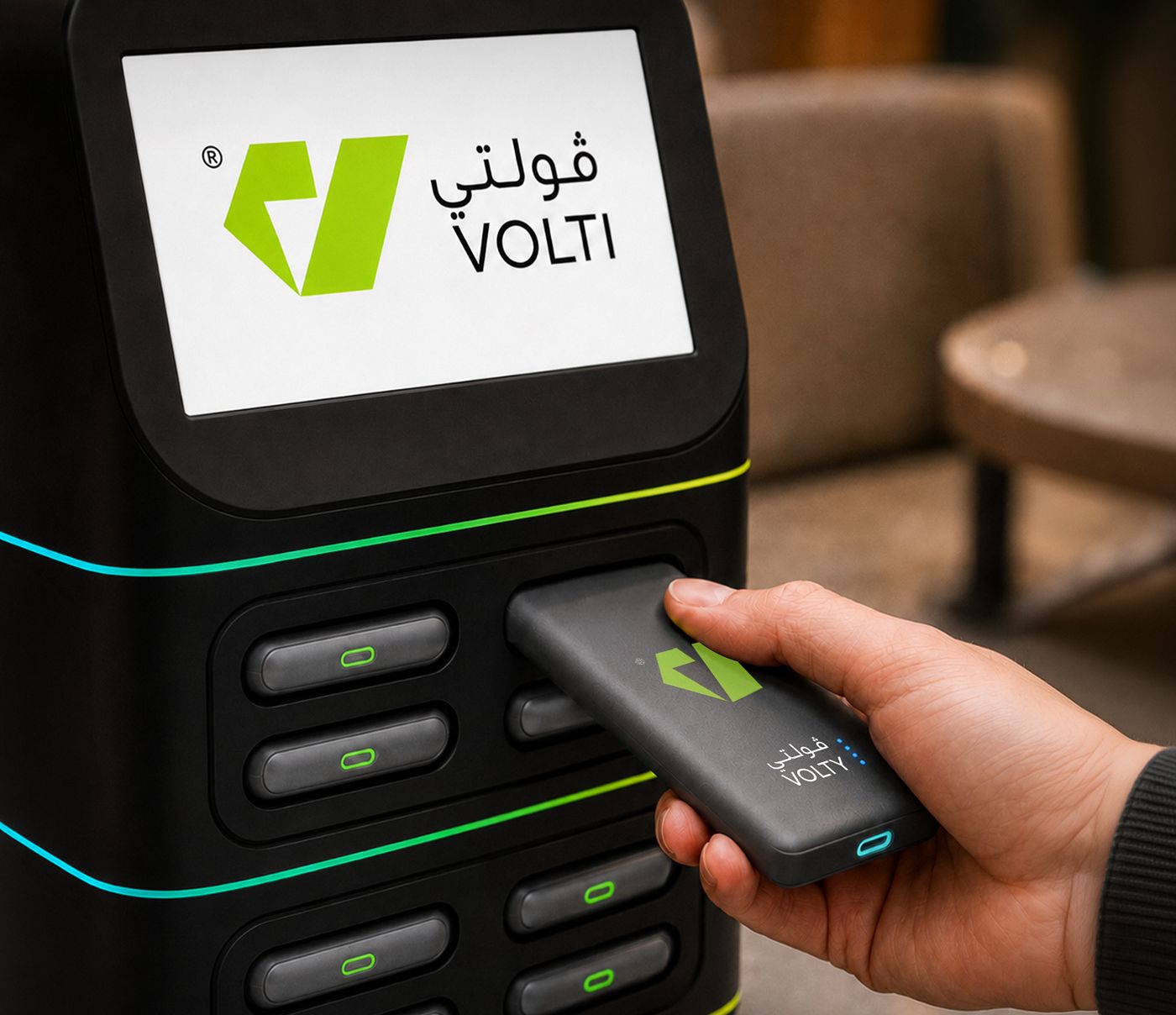 A hand taking a power bank from a Volti station